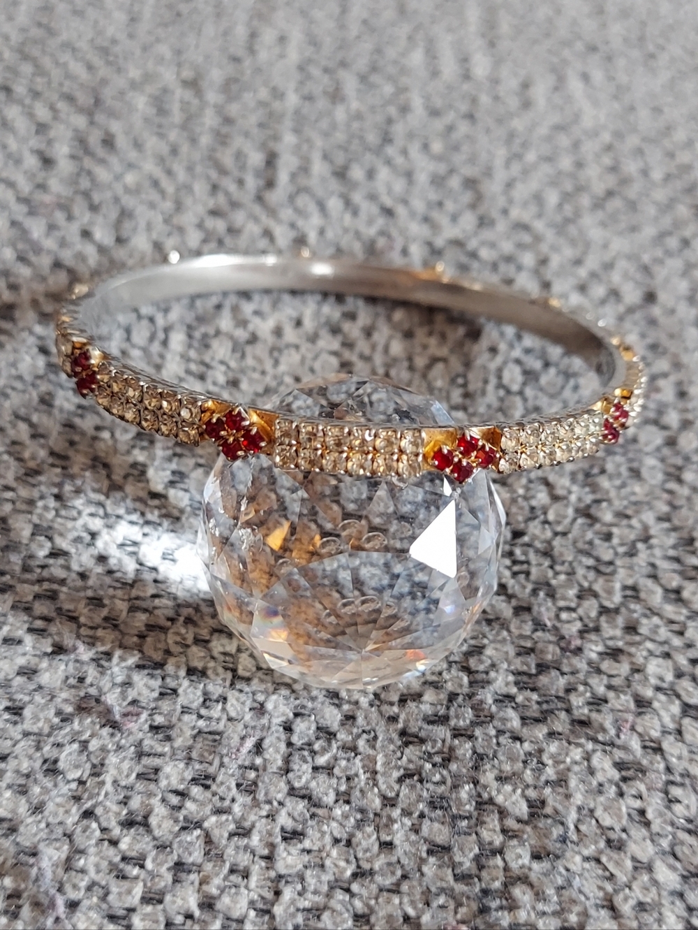 Gold-Tone Bangle Bracelet with Red Crystal Accents